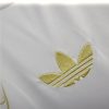 túnica Real Madrid diseño dragón oro para seguidor del club versión coleccionista 2425