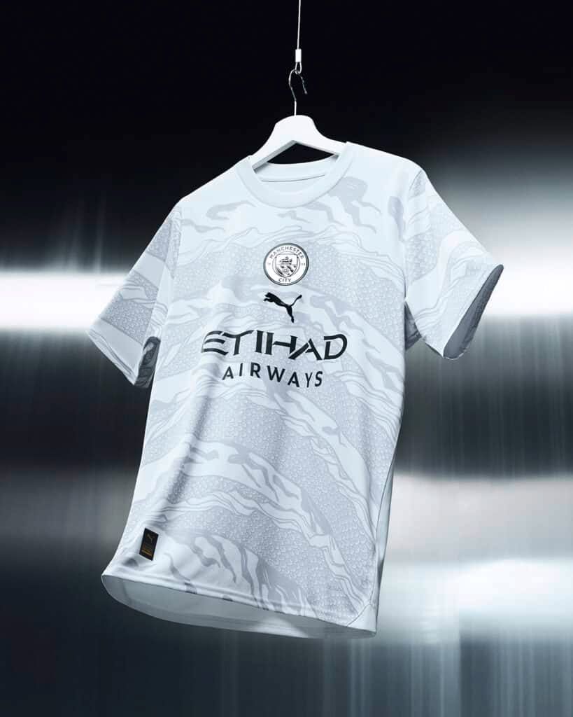 tunique-de-football-manchester-city-motif-dragon-collection-officielle-vingt-trois-vingt-quatre Tunique de football Manchester City motif dragon collection officielle vingt trois vingt quatre